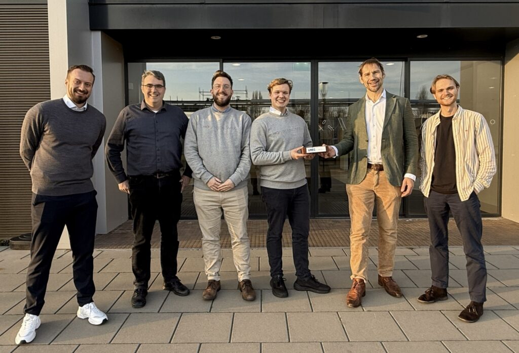 6 people outside of an office building